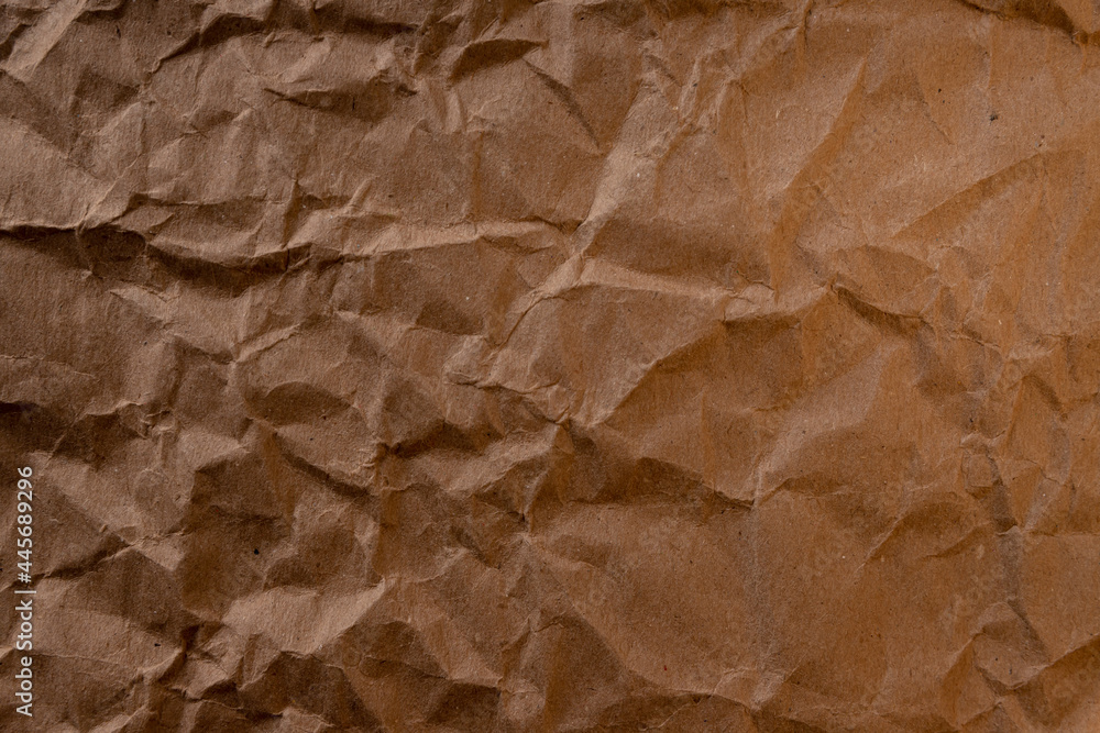 Fototapeta premium crumpled paper.sheet of brown cardboard paper. detailed high resolution texture. abstract background for wallpaper.