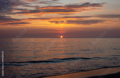 Beautiful sunset at the sea with romantic  colorful sky photographed from the dutch beach at Schoorl