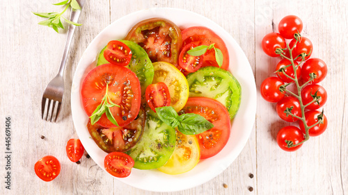 tomato salad slices with fresh basil