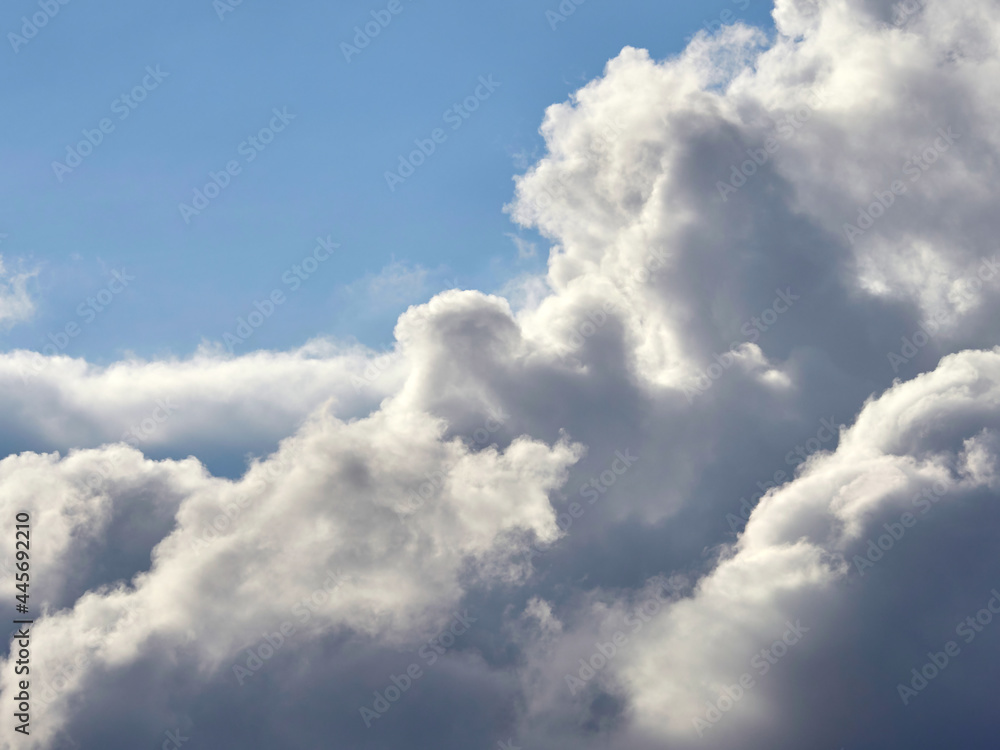 Dark and white clouds on a background of blue sky Dark and white clouds on a background of blue sky