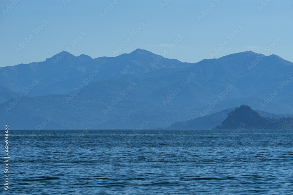 Lake maggiore during a sunny spring day near the Borromean islands and the town of Stresa, Italy - June 2021