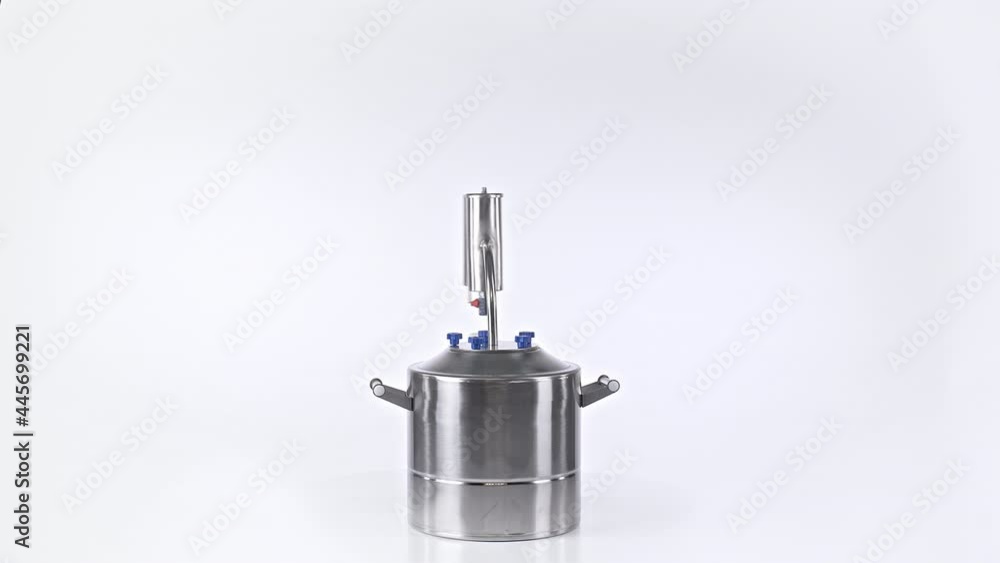 Shooting of isolated rotating moonshine distiller Shooting of isolated rotating moonshine distiller