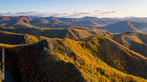 Height 611 in Dalnegorsk, where a UFO fell on January 29, 1986. View from above. The top of the mountain, overgrown with autumn trees. photo