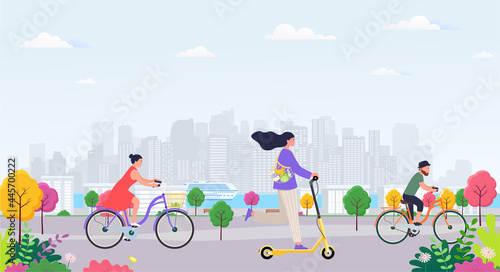 Young modern woman rides an electric scooter with grocery net bag. Man and woman ride bike in nature. Ecological transport concept on background of city.