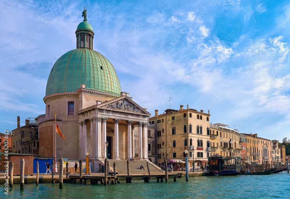 Beautiful church of San Simeone Piccolo on Grand Canal, Venice, Italy, daylight, blue sky, soft clouds, landmark of waterway, UNESCO world heritage