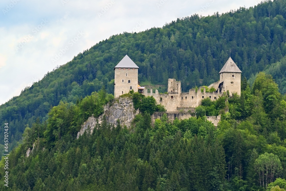 Castle ruins Gallenstein. Beautiful old castle in the Austrian Alps with forest and rock on the hill.