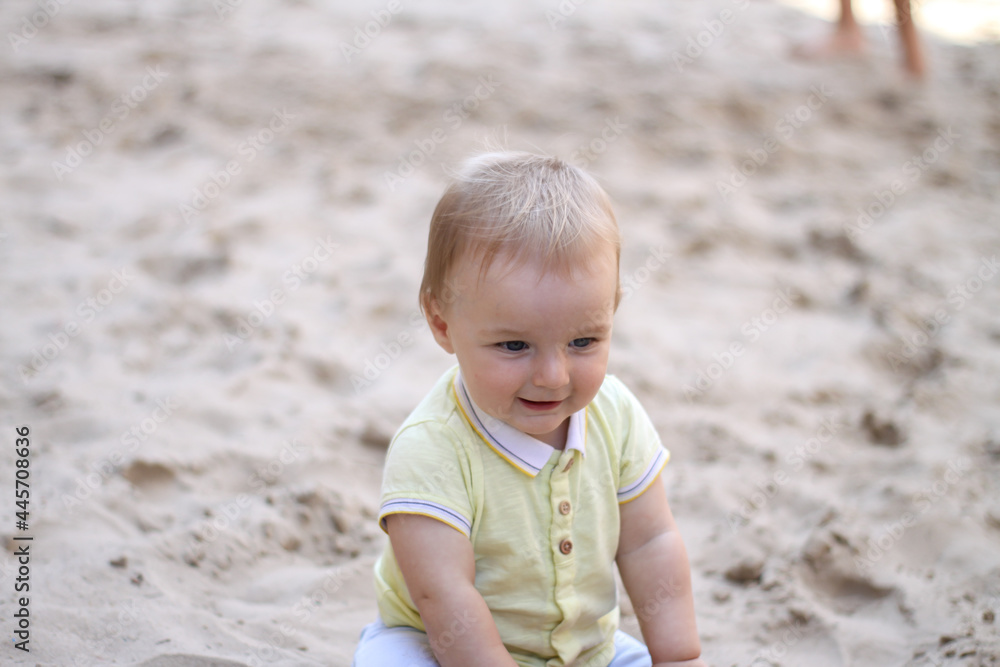 little boy playing in the sand. baby plays with sand. Summer rest. Sun, sea, beach, sand. Rest, childhood. little boy playing in the sand. baby plays with sand. Summer rest. Sun, sea, beach, sand. Rest, childhood.