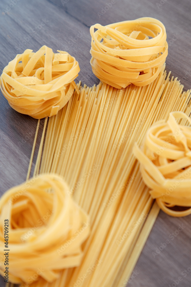 raw noodles and spaghetti pasta in the shape of a bouquet of flowers raw noodles and spaghetti pasta in the shape of a bouquet of flowers