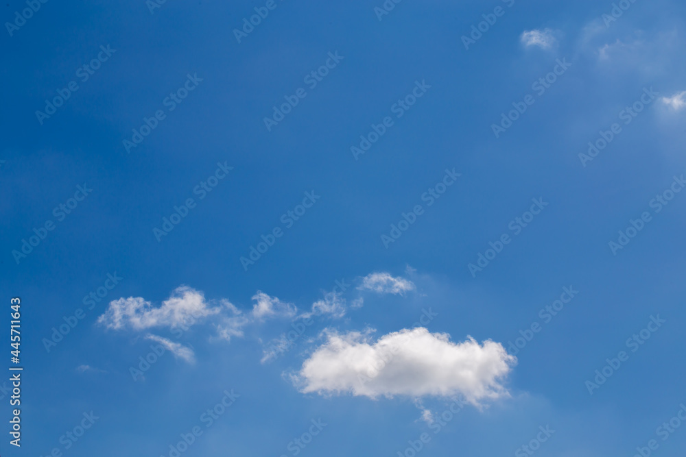 Little cloud on clear blue sky