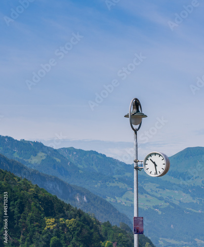 Clock post next to the lake - Switzerland