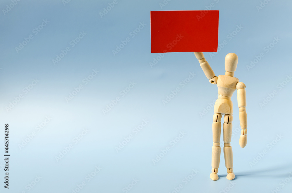 The figure of a wooden man holding a red poster in his hand. The figure of a wooden man with an empty signboard. The figure of a wooden man holding a red poster in his hand. The figure of a wooden man with an empty signboard.