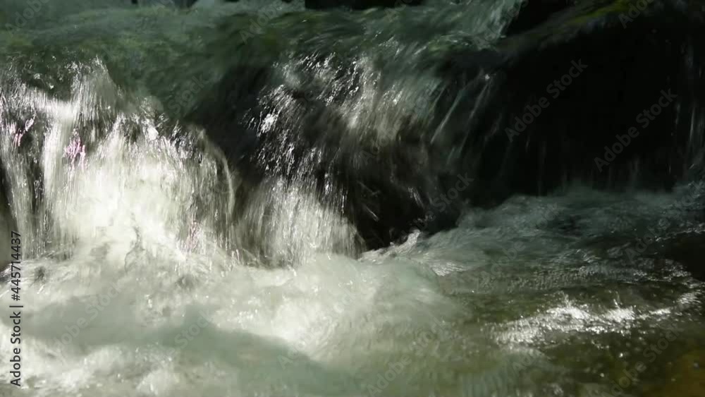 water flowing into the waterfall water flowing into the waterfall