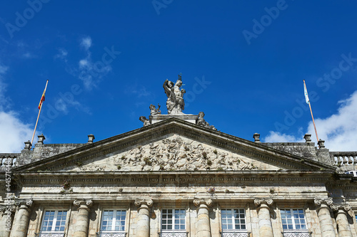 tympanum with sculptural scenes about Santiago Matamoros in the pediment above the Raxoi palace, headquarters of the Santiago City Council photo