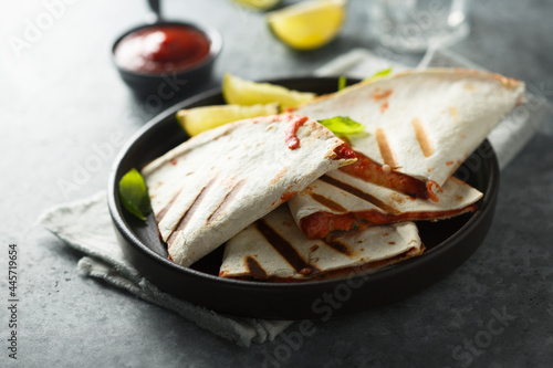 Traditional homemade Mexican quesadilla with tomatoes and cheese