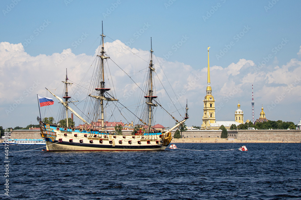 Sailboat Poltava in front of the Peter and Paul Fortress in St. Petersburg Sailboat Poltava in front of the Peter and Paul Fortress in St. Petersburg