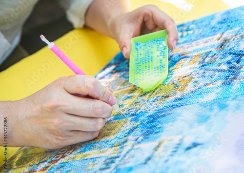 Diamond mosaic painting, Diamond mosaic, fragment of painting close-up, handmade hobby.