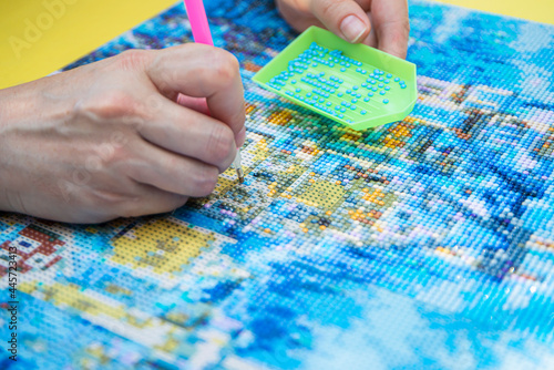 Diamond mosaic painting, Diamond mosaic, fragment of painting close-up, handmade hobby.