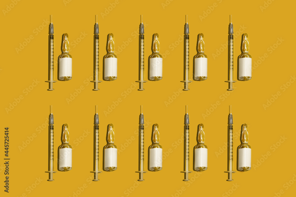 
Pattern glass syringes and capsules blank labels, gold isolated background.