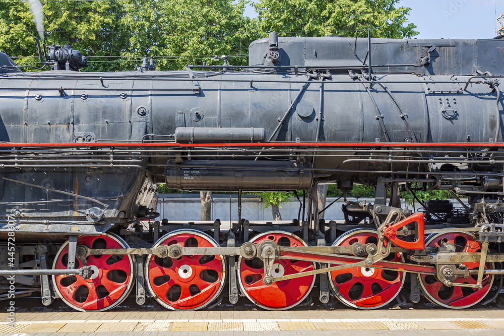 Black retro steam locomotive on the railway platform of the Rizhsky station. Moscow, Russia