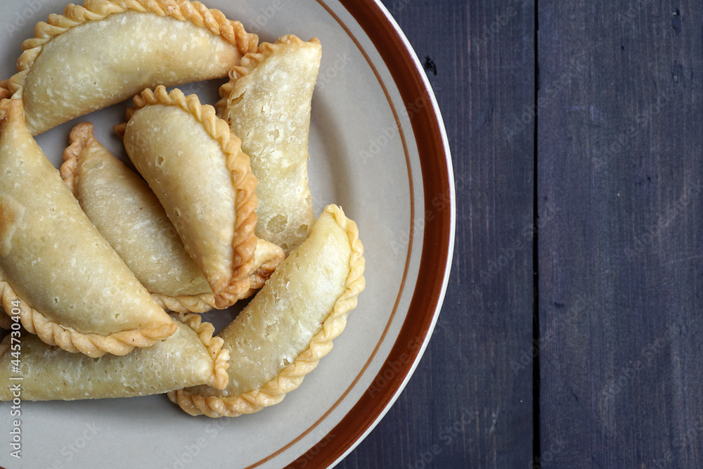 Indonesian Fried Pastry with Chicken Veggie Filling called Indonesian Fried Pastry with Chicken Veggie Filling called