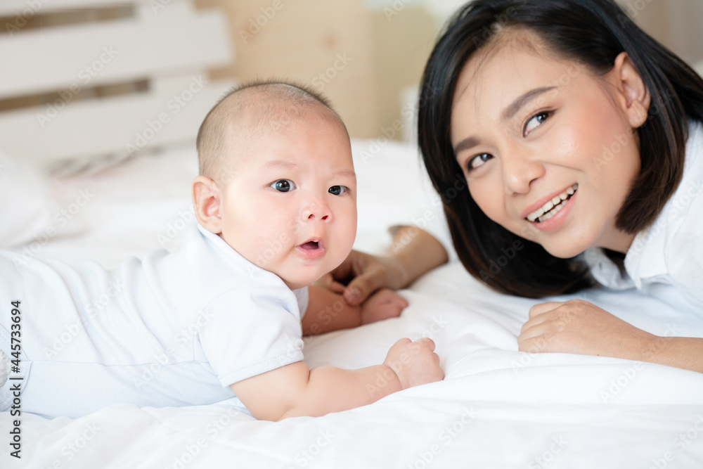 Asian children and mothers are happy and in love. good health of mother and child Asian children and mothers are happy and in love. good health of mother and child