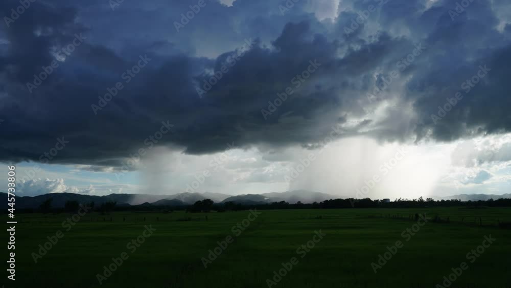 Dramatic Rainstorm moving over a mountain in Thailand Dramatic Rainstorm moving over a mountain in Thailand