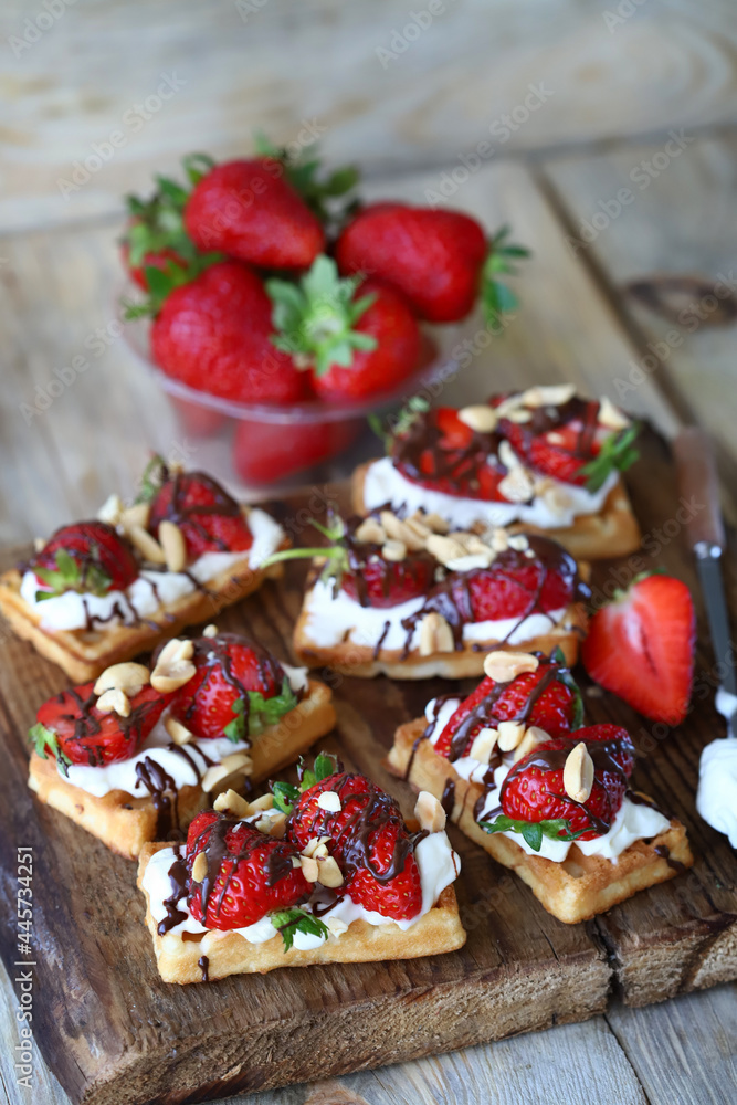Waffles with cream cheese and strawberries. Healthy breakfast or dessert. Waffles with cream cheese and strawberries. Healthy breakfast or dessert.