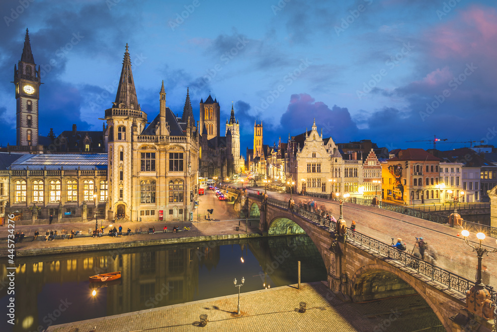 High point of view of Medieval city of Gent in Flanders with Saint Nicholas Church and Gent Town Hall, Belgium. Sunset cityscape of Gent.