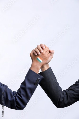 Young Indian man handshaking after good deal