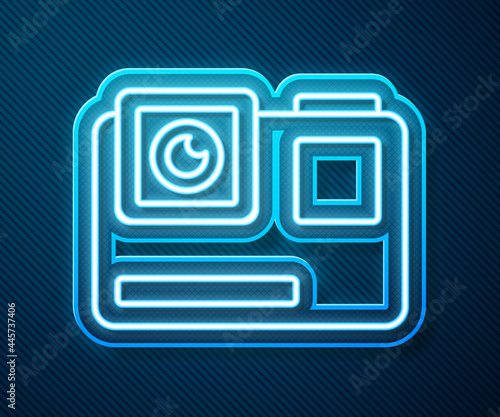 Glowing neon line Action extreme camera icon isolated on blue background. Video camera equipment for filming extreme sports. Vector Illustration