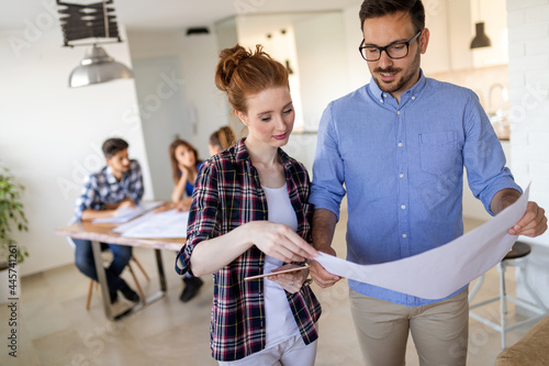 Successful business people on meeting while working together with colleagues in office photo