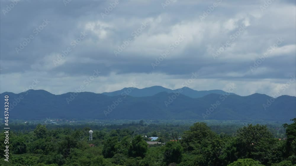 Dramatic  of rain storm over the mountain range and rice fields in Thailand