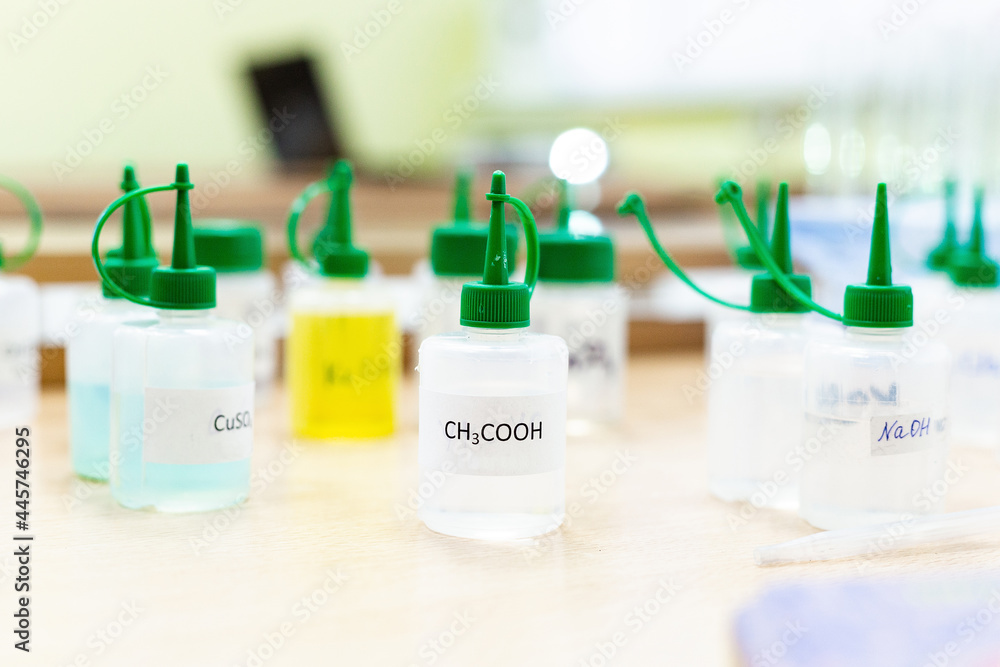Chemical industry flask with liquid laboratory test tubes are on the table in the laboratory of liquid testing development of tests substances poisons additives stabilizers flavors cleaning the house Chemical industry flask with liquid laboratory test tubes are on the table in the laboratory of liquid testing development of tests substances poisons additives stabilizers flavors cleaning the house