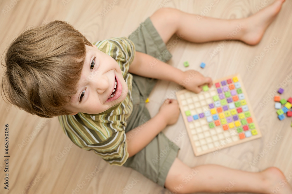 Mats educational game. To develop fine motoric skills, logical thinking, tool for primary school pupils and aspiring maths pros. Colorful wood cubes with numbers, digits, basic arithmetic operations Mats educational game. To develop fine motoric skills, logical thinking, tool for primary school pupils and aspiring maths pros. Colorful wood cubes with numbers, digits, basic arithmetic operations