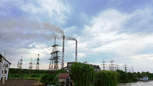 Wallpaper Mural Manufacturing with chimneys among nature. Harmful industrial territory with smoke going from factory. High-voltage electric towers in the countryside. Air pollution. Torontodigital.ca