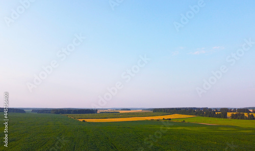 Aerial view of suburban fields and meadows summer