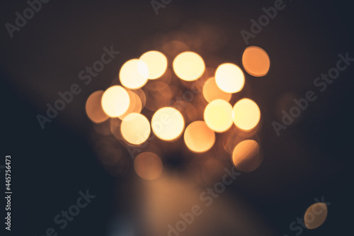 Abstract background of bokeh from chandelier lamp at night.. Luxury of light.