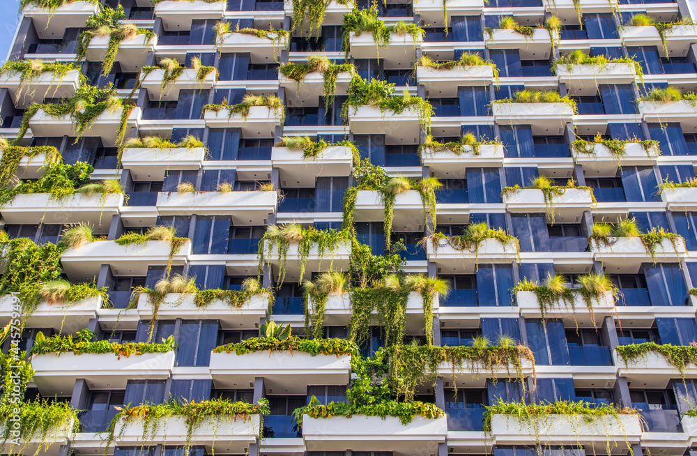 Fototapeta premium a tastefully contemporary green facade of a multi-storey building