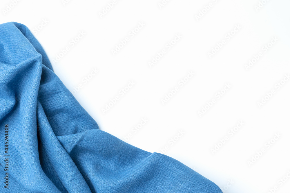 Cotton textile is wave beautiful for wallpaper. Top view blue fabric luxurious softness smooth on white background with copy space. Design textured, abstract, background.