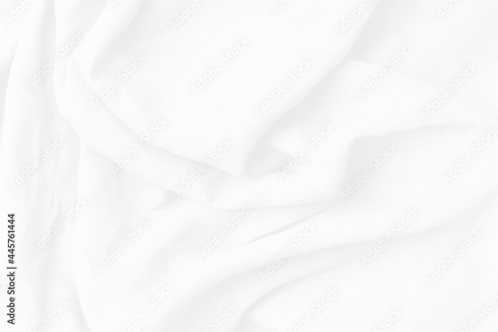 Abstract white fabric luxurious softness smooth on white background. Textured, abstract, background. Cotton textile is wave beautiful  for wallpaper.