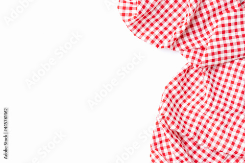 Cloth cotton crumpled tablecloth. Top view fabric red and white checkered isolated on a white background with copy space.