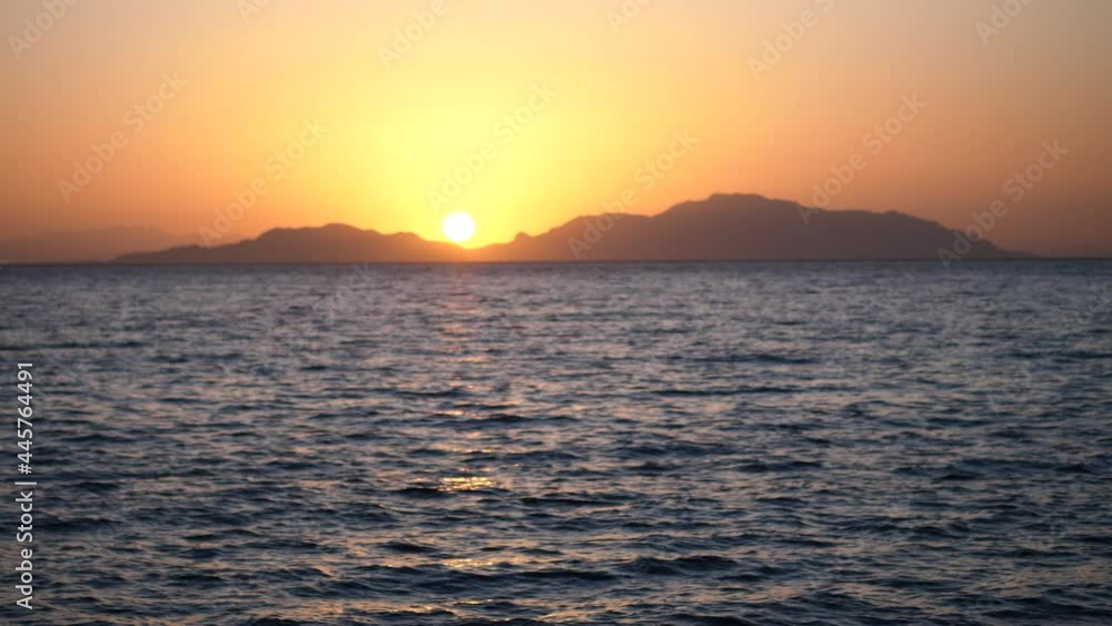 Red sunsets over sea video 4K. The sun touches horizon. Red sky, yellow sun and amazing sea. Summer sunset seascape. Red sea sunsets. Fantastic natural sunset Red sunsets over sea video 4K. The sun touches horizon. Red sky, yellow sun and amazing sea. Summer sunset seascape. Red sea sunsets. Fantastic natural sunset
