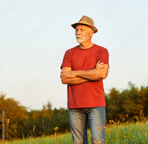 portrait senior man elderly old retirement mature gray hair farm farmer outdoor healthy active retired hat