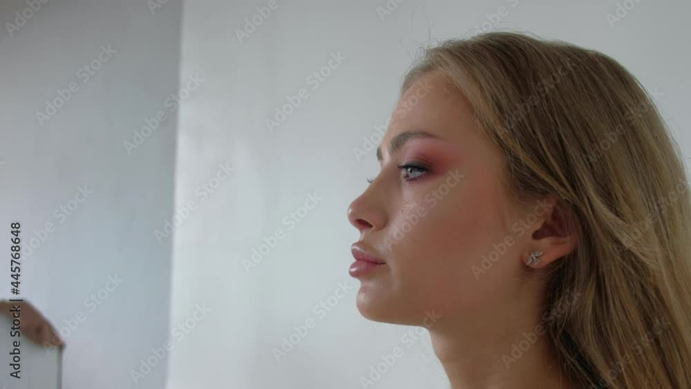 Young Makeup Artist Doing Makeover for Model lips. The work of a professional makeup artist. Concept of fashion or beauty. Young Makeup Artist Doing Makeover for Model lips. The work of a professional makeup artist. Concept of fashion or beauty.
