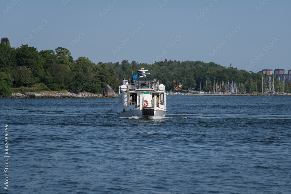 Old passenger boat from year 1902, Kung Ring, arriving at the district Nacka strand in Stockholm. Old passenger boat from year 1902, Kung Ring, arriving at the district Nacka strand in Stockholm.