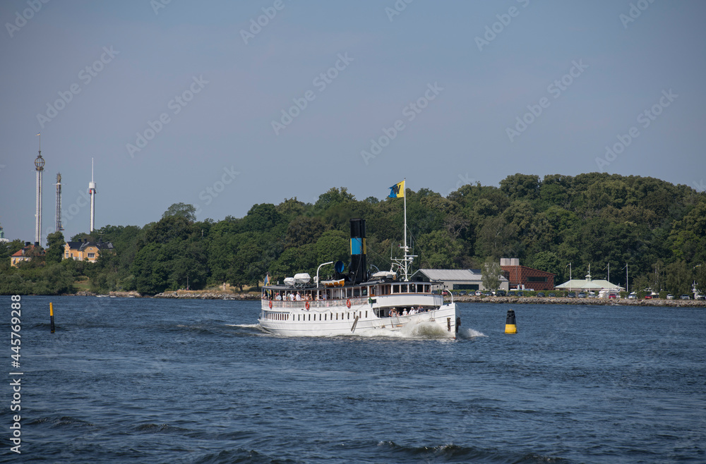 Old steam boat Waxholm III approaching leaving Stockholm for a journey in the archipelago