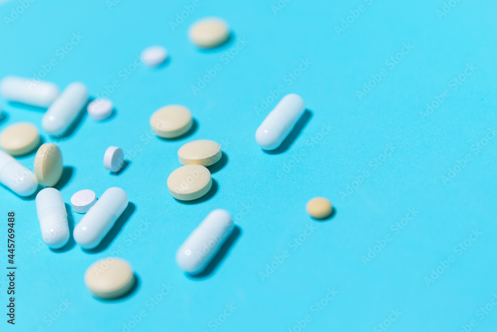 close up. various tablets on a blue background. close up. various tablets on a blue background.