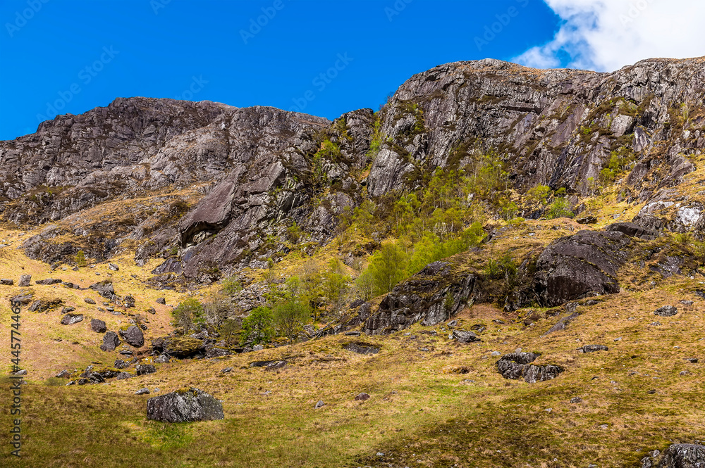 A view along the upper reaches of the valley in front of the Steall Waterfall in Glen Nevis, Scotland on a summers day