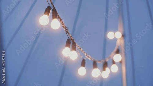 Light Bulbs Garland Close Up. Electric Bulb Shine Hanging  As Decoration