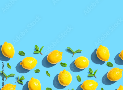 Fresh yellow lemons with mints overhead view